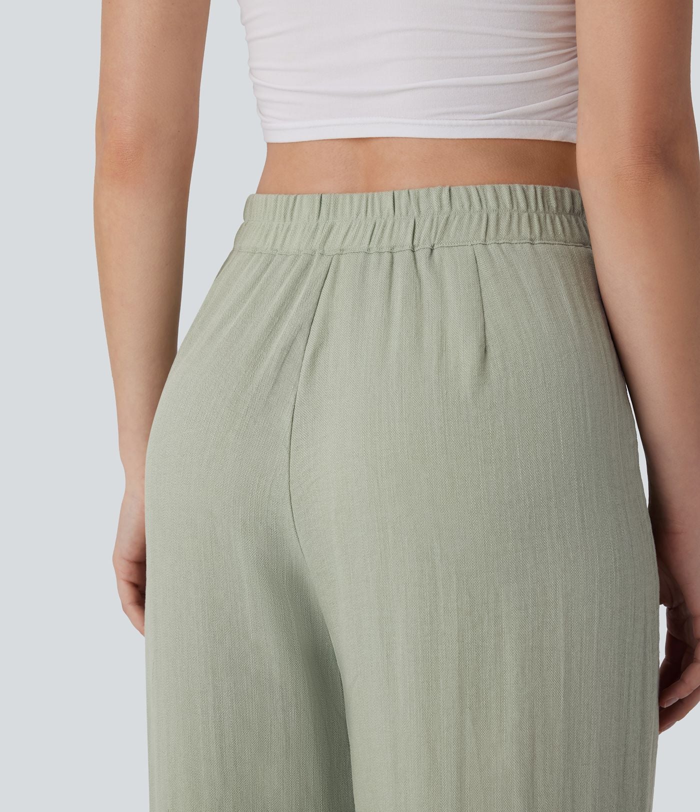 Pantalon large et fluide aspect lin taille haute, boutonné avec poches