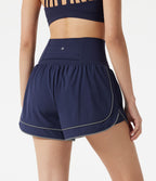 Short de yoga baggy 2-en-1 Breezeful™ taille haute à ourlet arrondi, séchage rapide, lignes réfléchissantes et poches