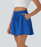 Short large décontracté taille haute façon paperbag avec cordon, poches latérales et aspect lin