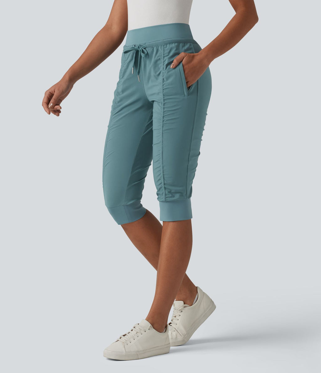 Jogging fuselé taille haute avec cordon de serrage et poches zippées