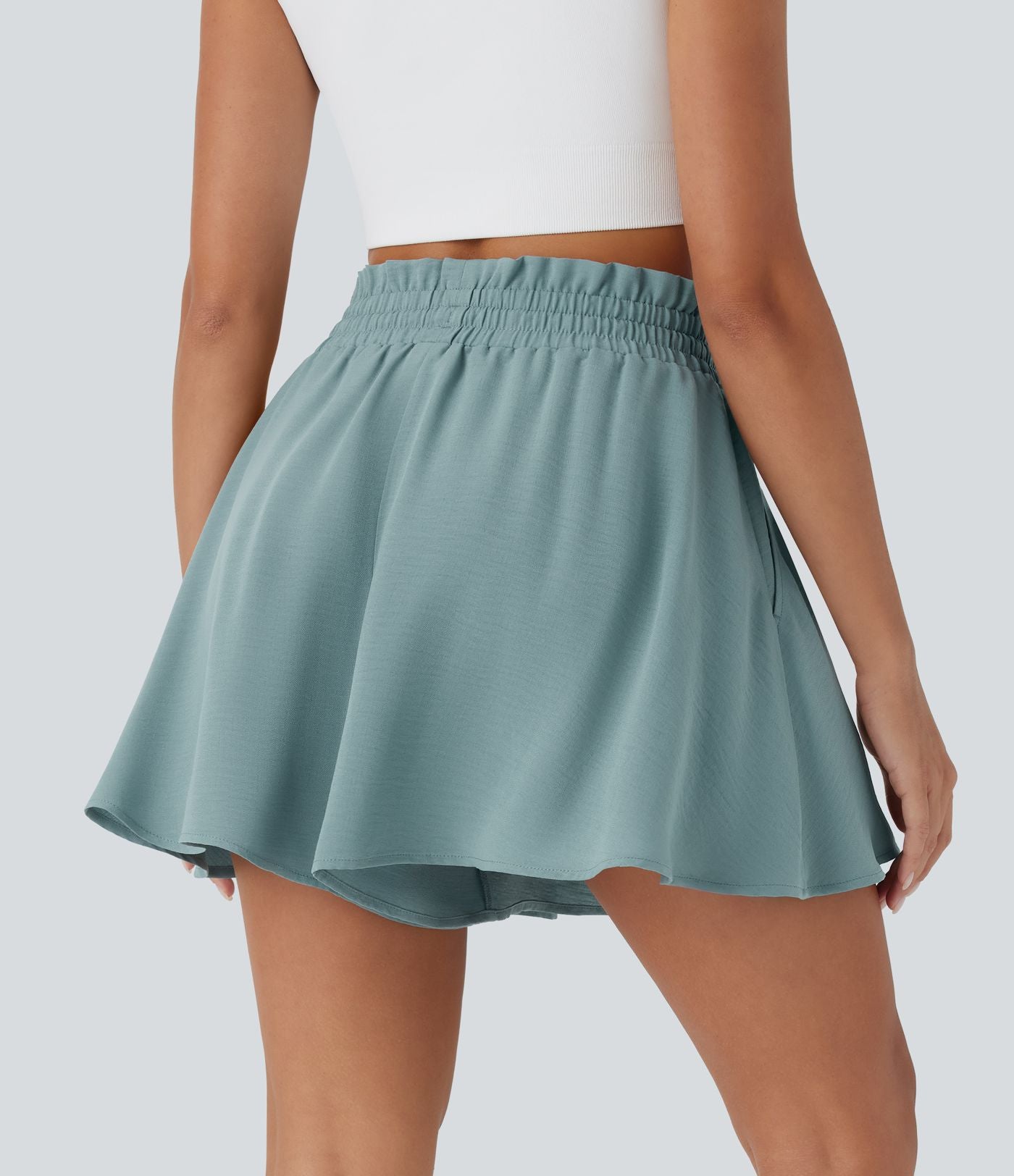Short large décontracté taille haute façon paperbag avec cordon, poches latérales et aspect lin