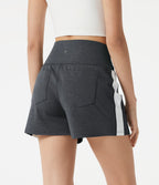 Short baggy de sport taille haute à séchage rapide avec bandes latérales et poches