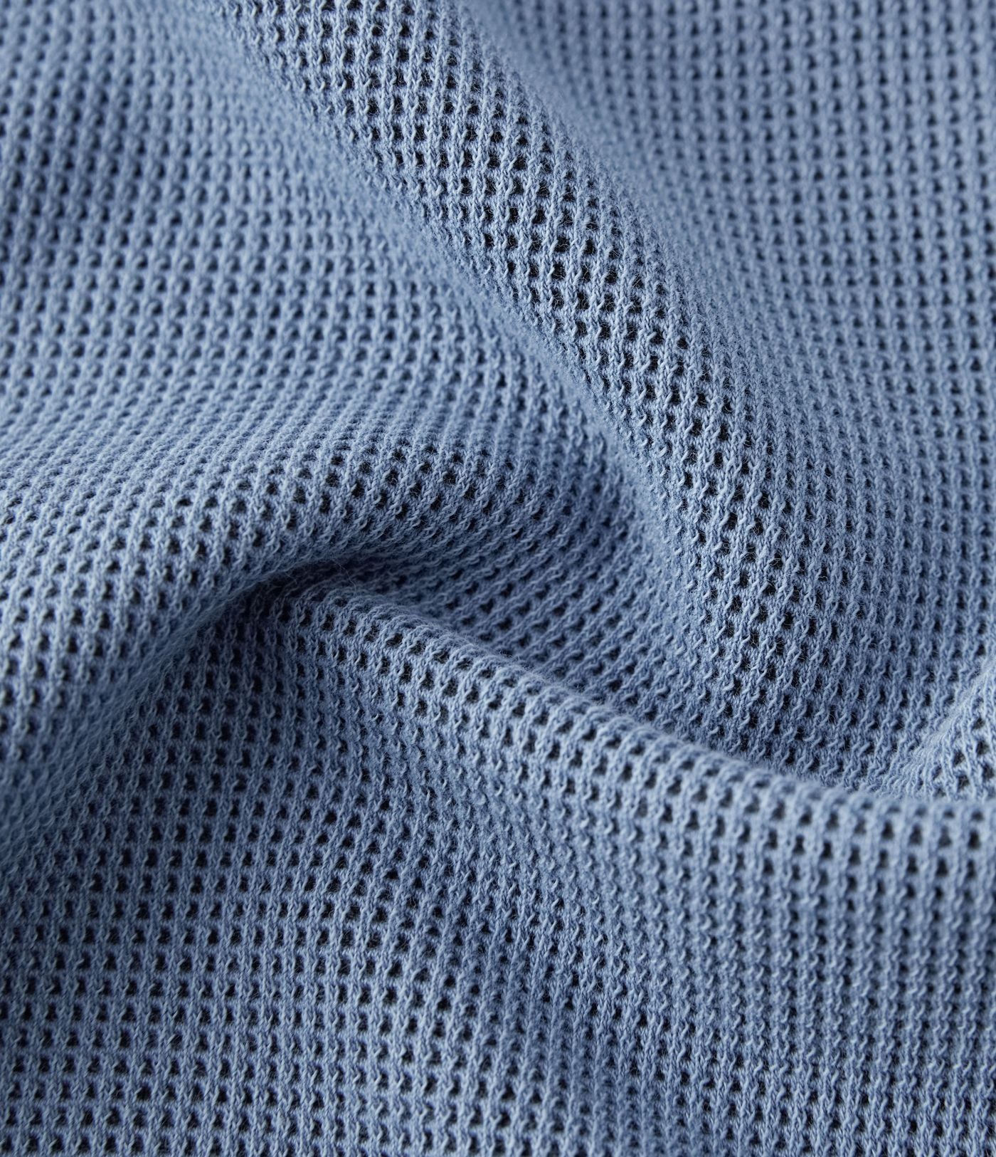 Jean décontracté taille basse en maille gaufrée extensible, jambe large avec poches multiples et fermeture zippée