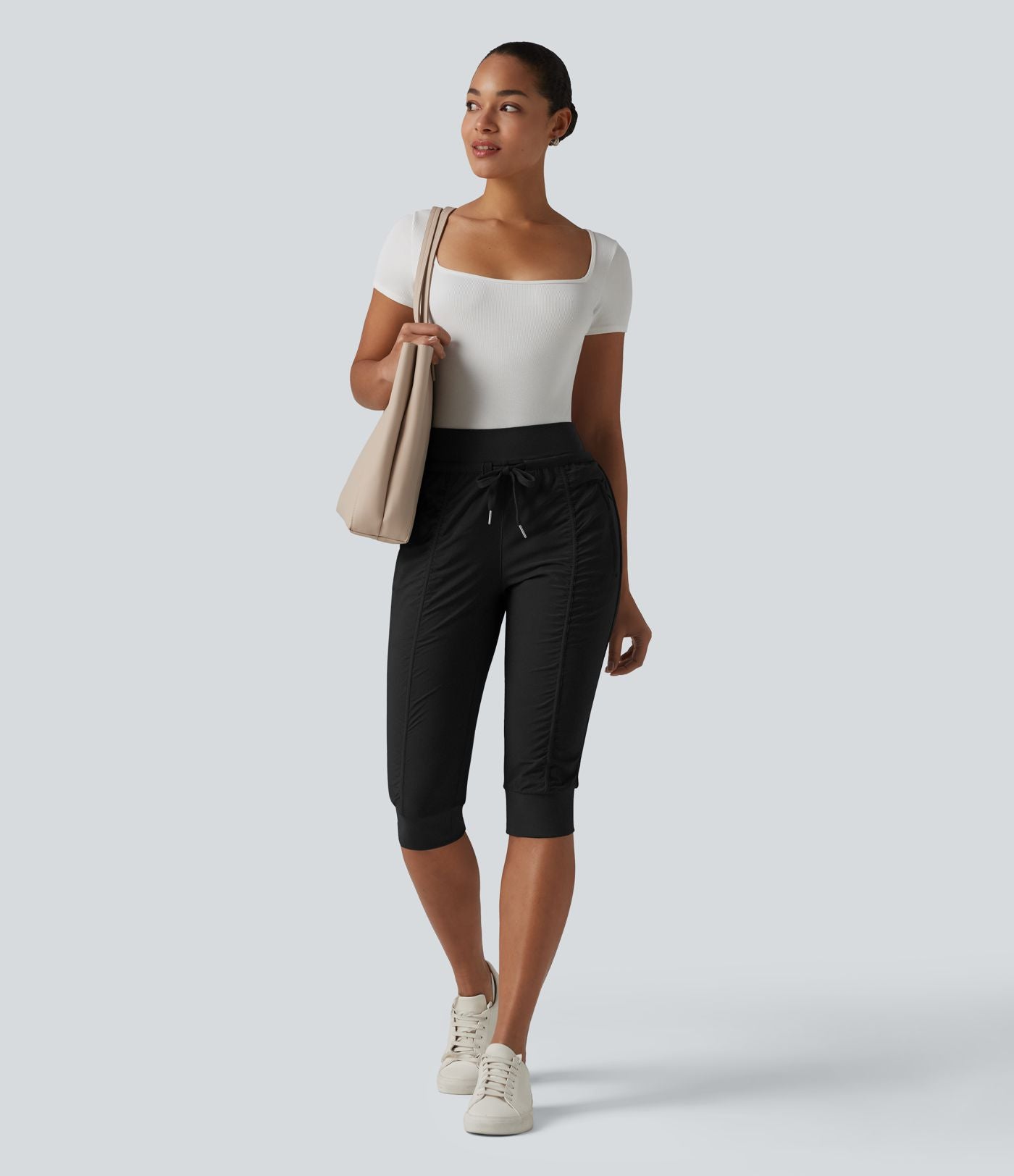 Jogging fuselé taille haute avec cordon de serrage et poches zippées