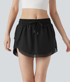 Mini-jupe de tennis 2-en-1 taille moyenne avec cordon de serrage, filet contrasté et poches latérales
