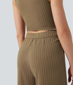 Combinaison tailleur rayée à jambes larges, décolleté en V, découpe et poches