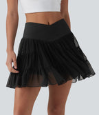 Jupe-short de tennis mini taille haute croisée fluide avec poches