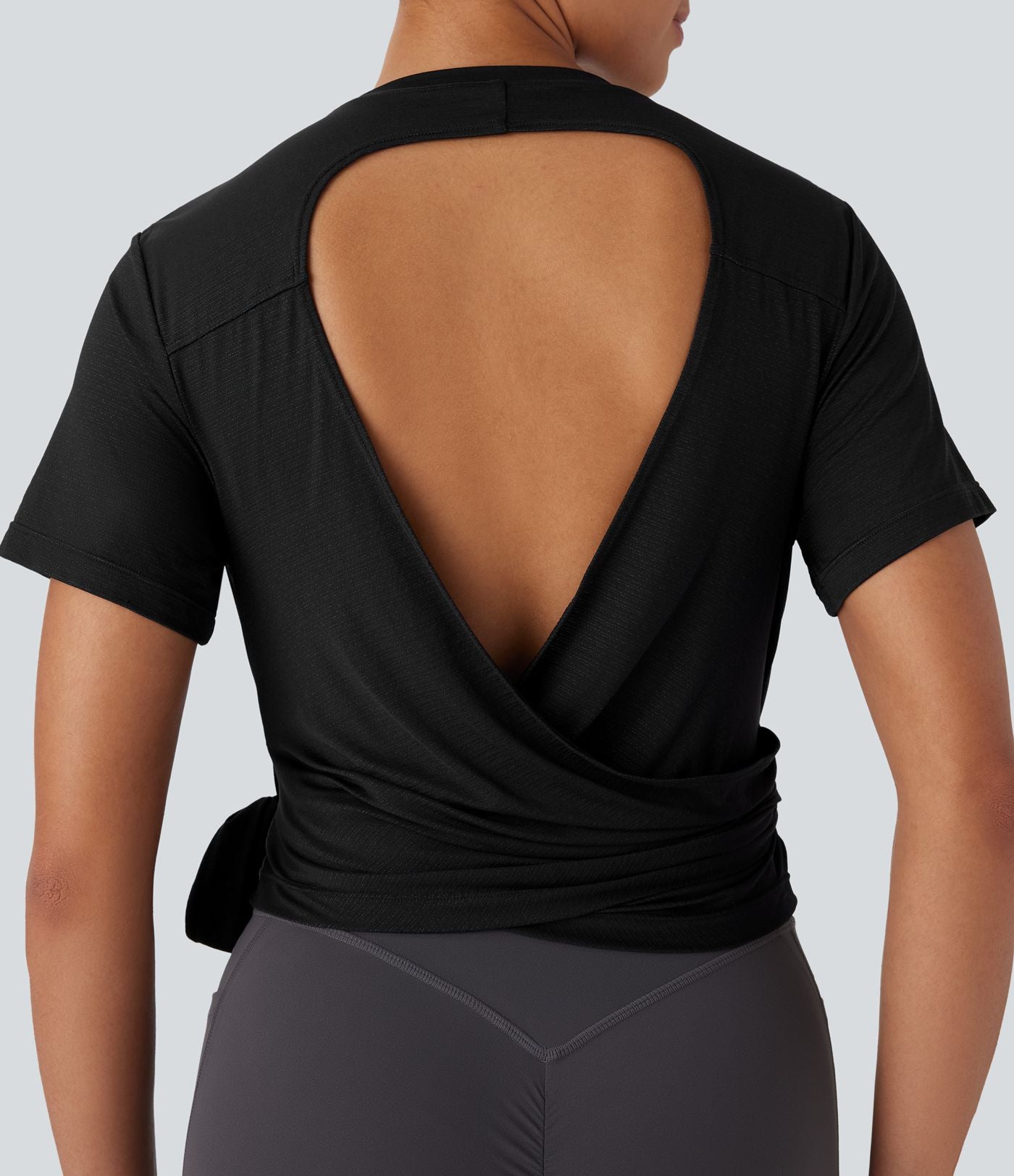 Haut de sport yoga à col rond, manches courtes, dos nu et nœuds latéraux