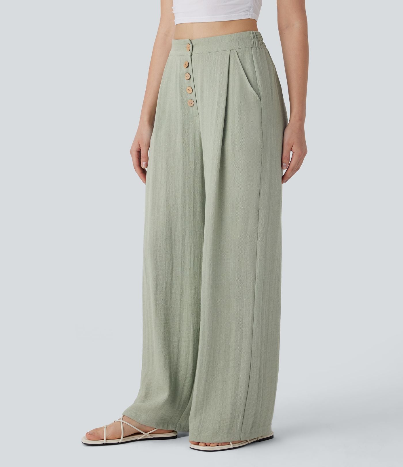 Pantalon large et fluide aspect lin taille haute, boutonné avec poches