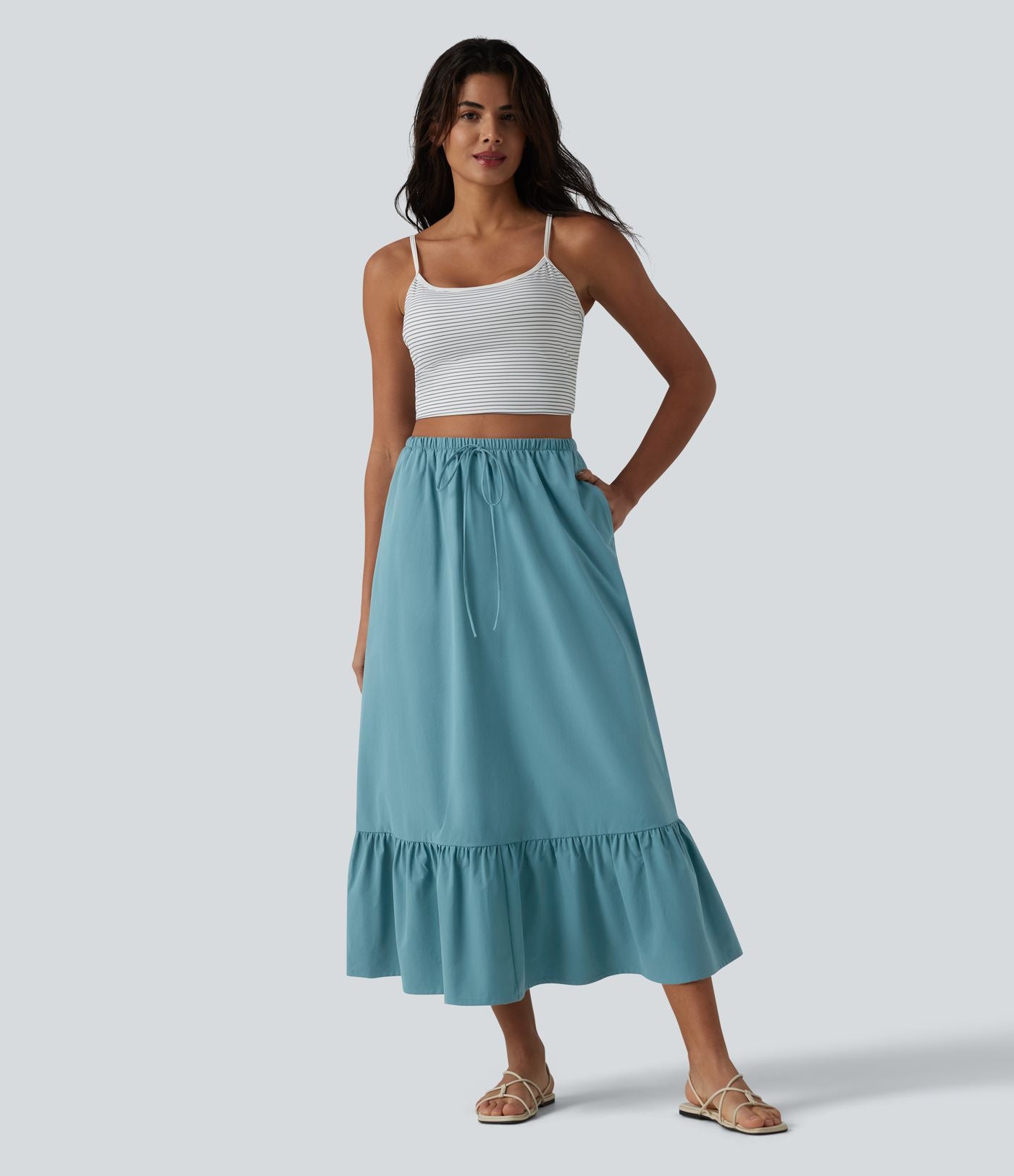 Jupe casual mi-longue évasée en popeline stretch taille haute avec cordon de serrage, ourlet volanté et poches