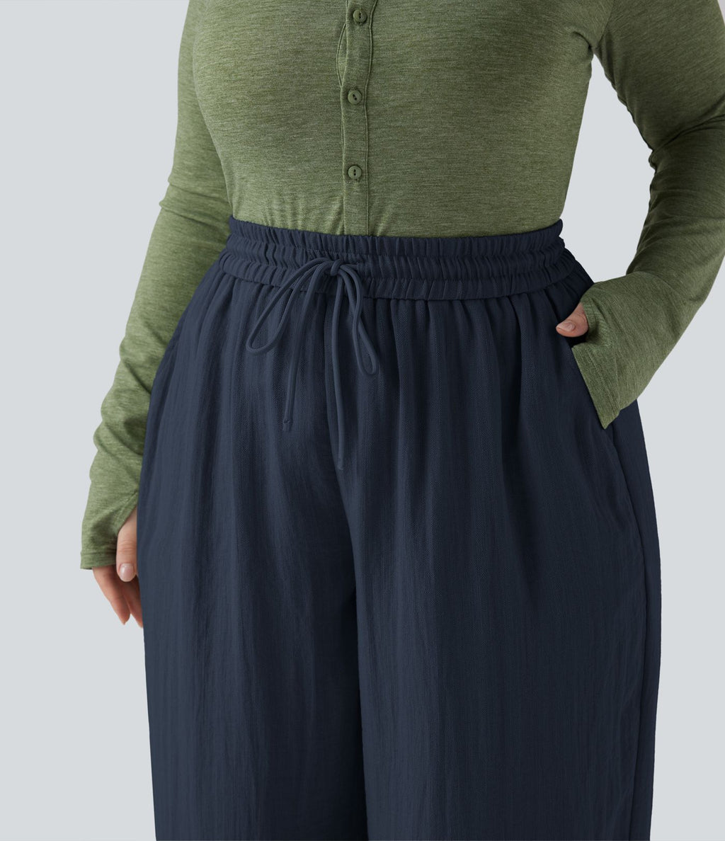 Pantalon grande taille large fluide taille haute avec cordon de serrage, poches et aspect lin