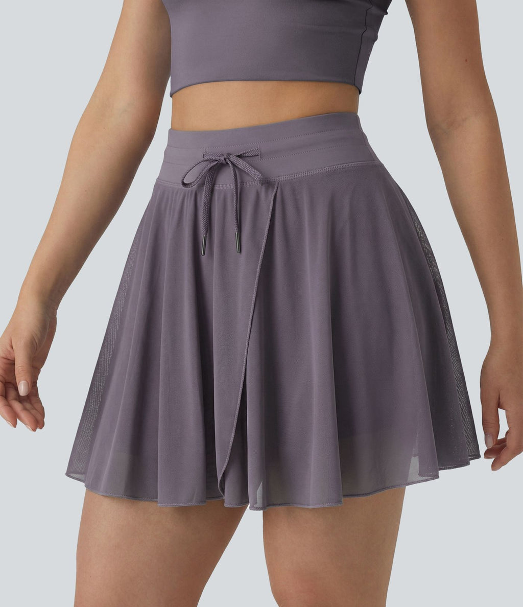 Jupe mini fluide évasée 2-en-1 taille haute à cordon, empiècements en mesh contrastant, avec poche, version plus longue