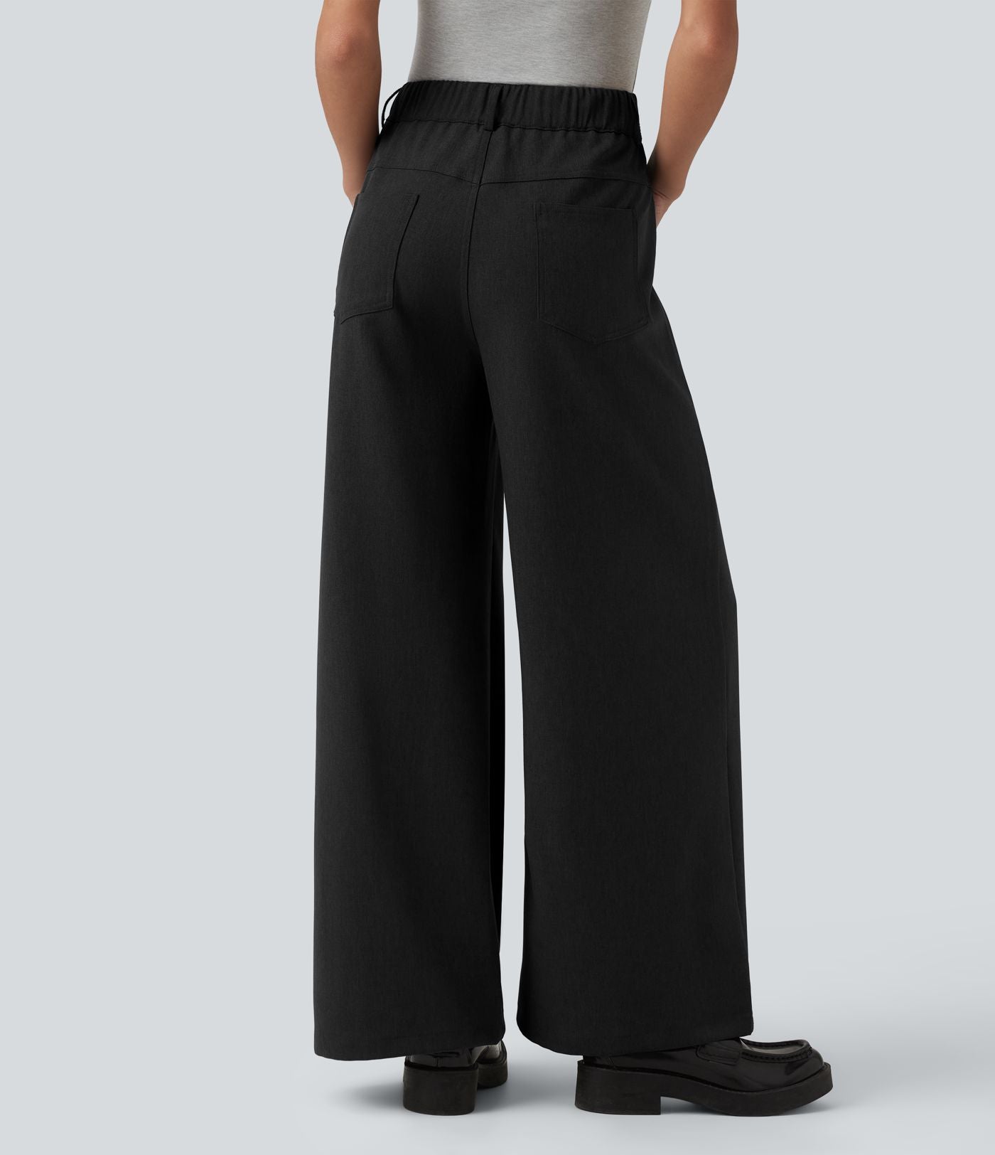 Pantalon tailleur ample taille mi-haute avec poches
