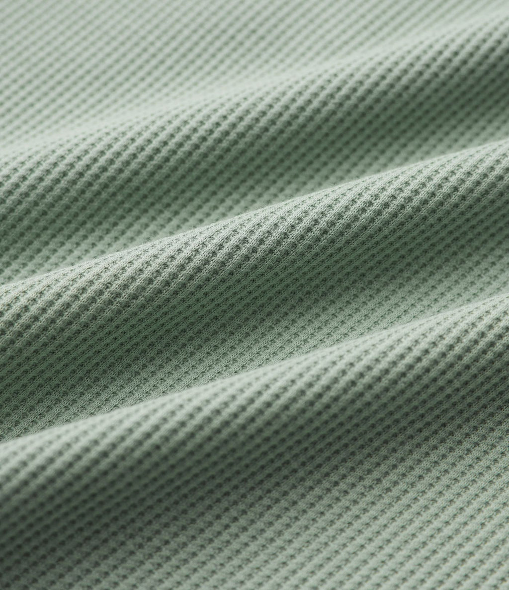 Robe mini gaufrée col cranté sans manches cordon de serrage avec poches