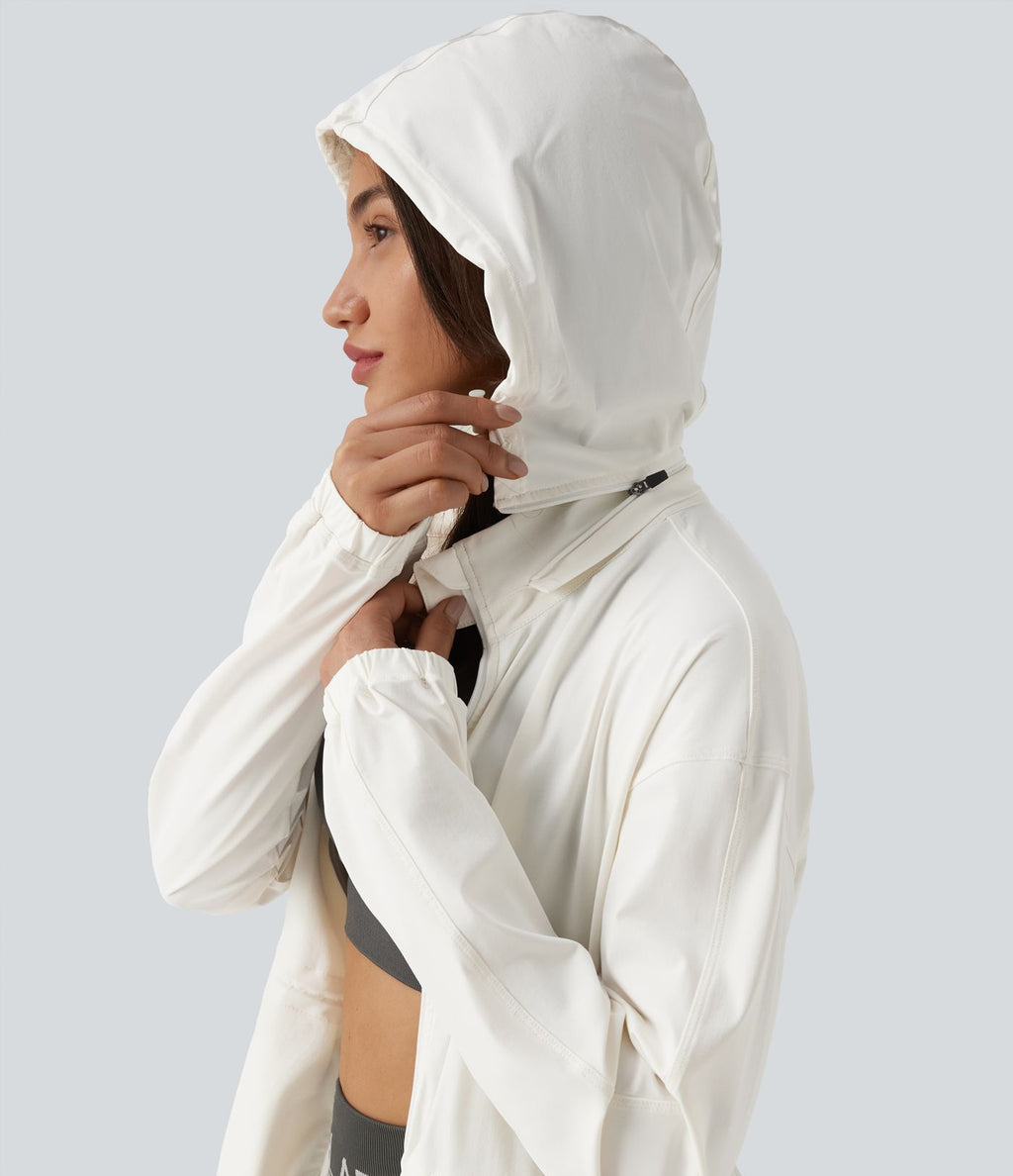 Veste de sport déperlante à capuche amovible avec cordon de serrage et poches zippées