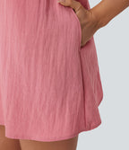 Robe courte aspect lin décolletée en V pour les vacances, à bretelles réglables, dos nu avec lien à nouer et poches latérales