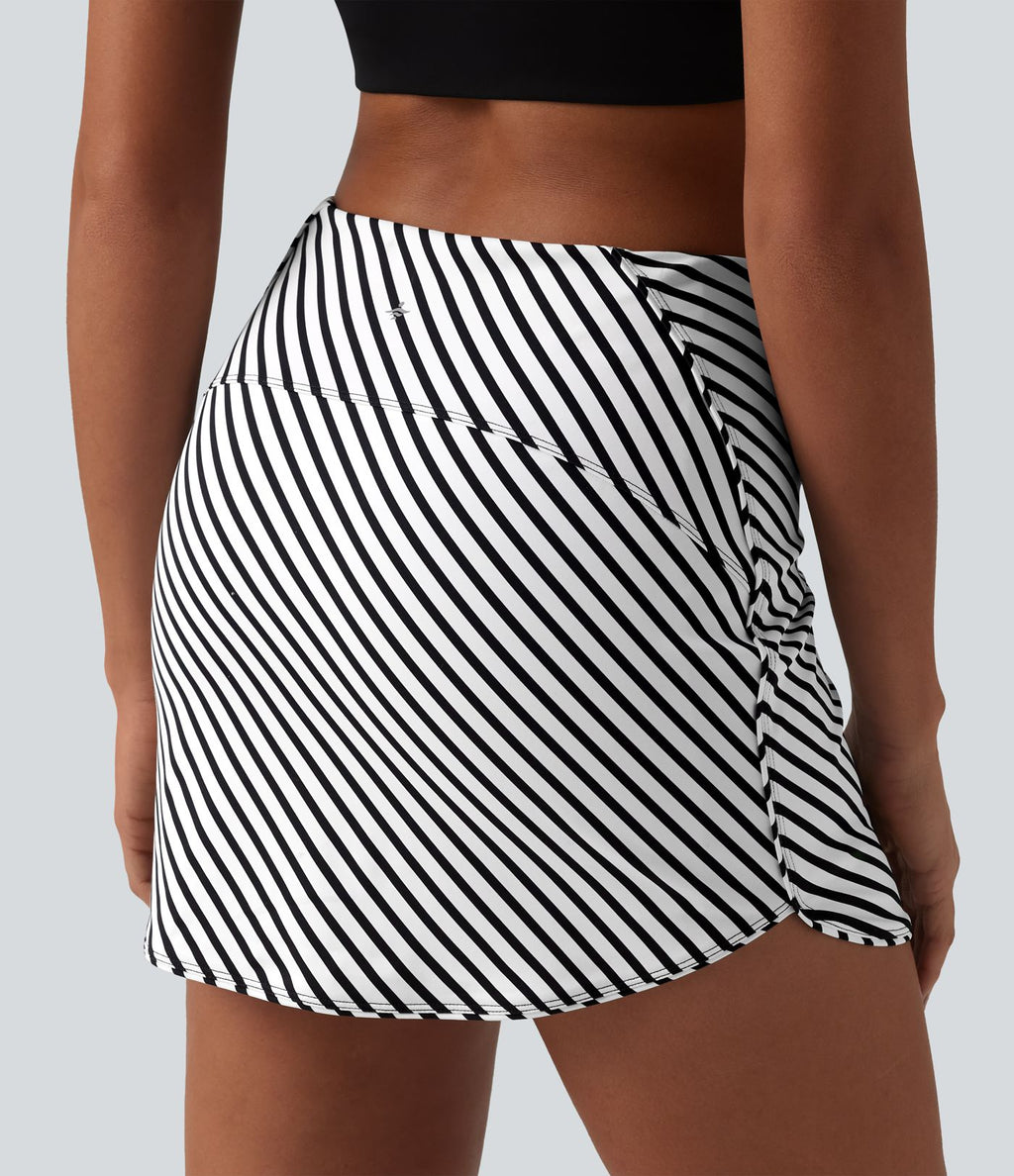 Jupe mini de tennis 2-en-1 à rayures taille haute avec ourlet arrondi et poches