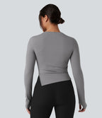 Top de sport yoga col rond ourlet asymétrique fendu manches longues avec trous pouces