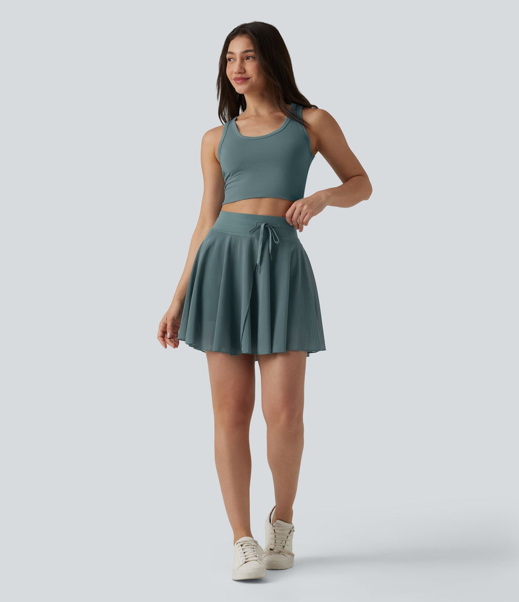 Jupe mini fluide évasée 2-en-1 taille haute à cordon, empiècements en mesh contrastant, avec poche, version plus longue