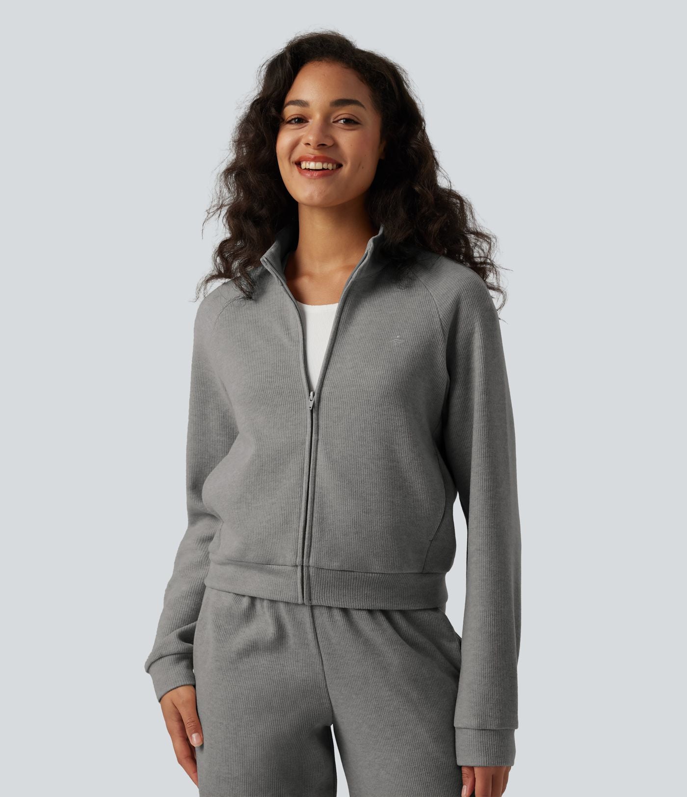 Veste casual côtelée à col montant, manches longues et fermeture zippée avec poches