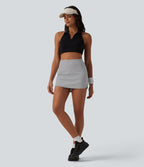 Jupe mini de tennis 2-en-1 à rayures taille haute avec ourlet arrondi et poches