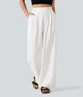 Pantalon tailleur large, taille haute, à poches