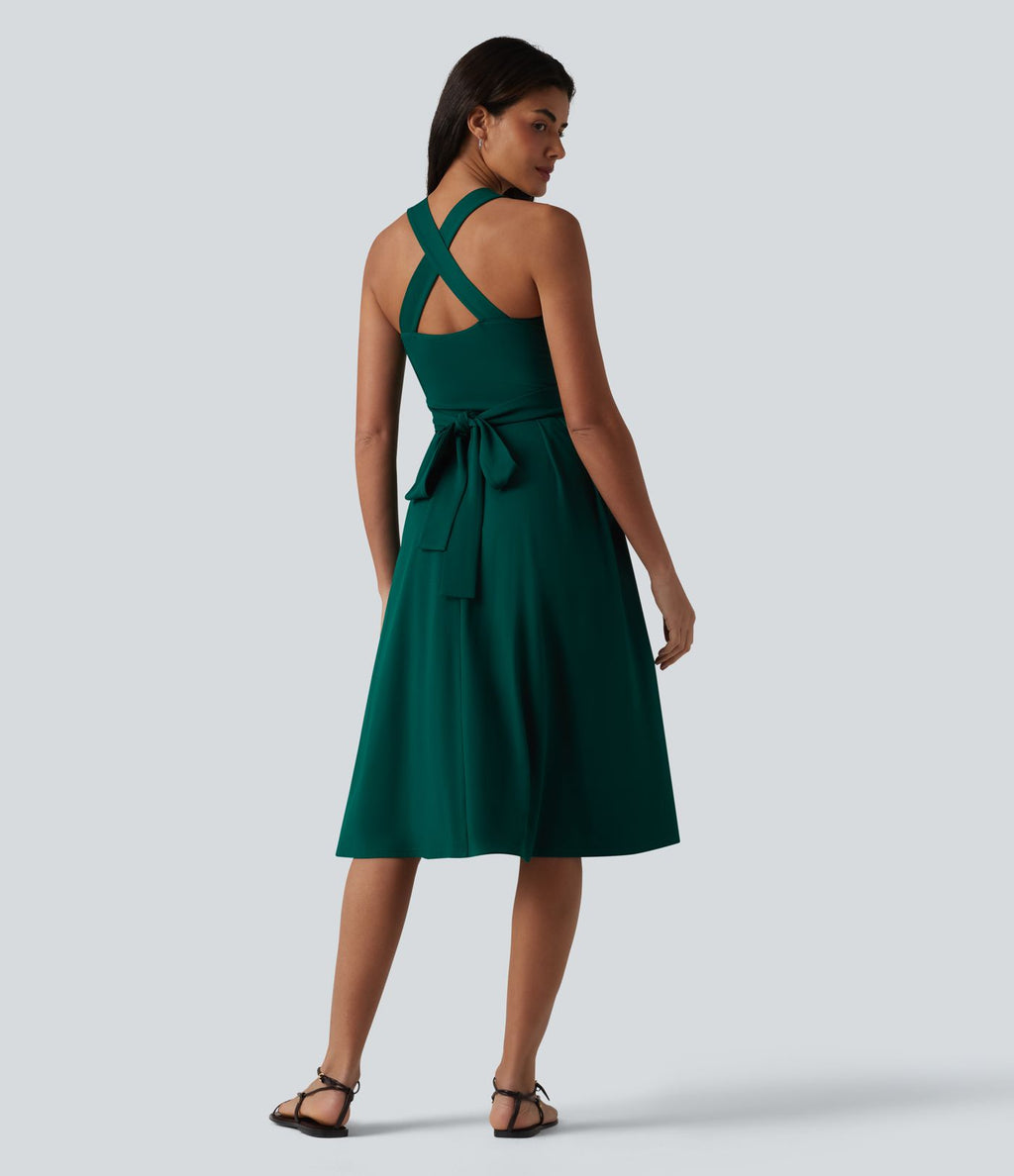 Robe midi fluide sans manches décolleté cœur avec bretelles croisées, nœud dans le dos et poches
