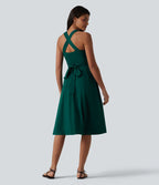 Robe midi fluide sans manches décolleté cœur avec bretelles croisées, nœud dans le dos et poches